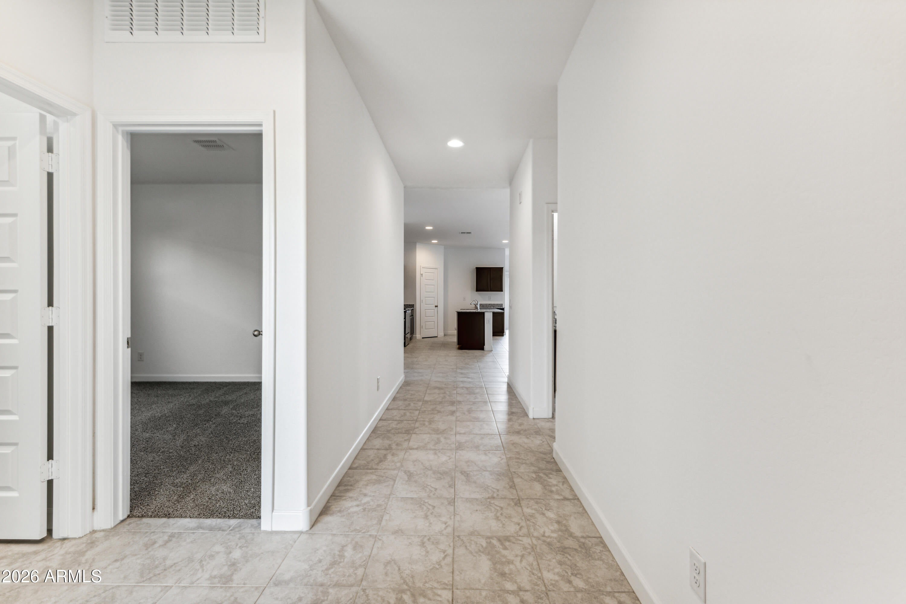 17885 North Ravello Road Maricopa, AZ 85138 - Photo 3 of 35 a view of a hallway with wooden shelves