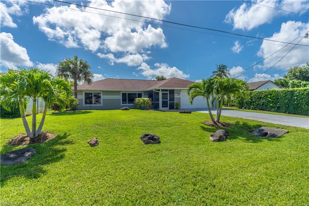 2100 55th Street Southwest Naples, FL 34116 - Photo 4 of 50 a view of house with garden