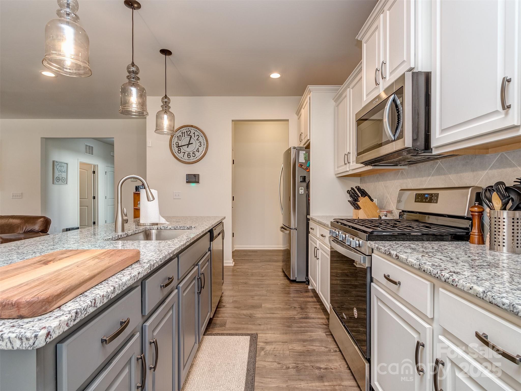 5220 Admirals Landing Lancaster, SC 29720 - Photo 12 of 48 a kitchen with stainless steel appliances granite countertop a stove and a sink