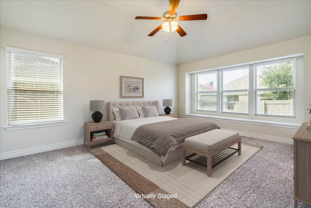 124 Compass Lane Kyle, TX 78640 - Photo 16 of 38 a spacious bedroom with a bed and a window