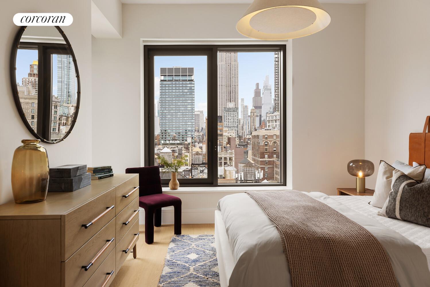 39 West 23rd Street, Unit PH20 Manhattan, NY 10010 - Photo 10 of 15 a bedroom with a bed and a large mirror next to a window