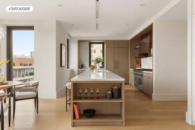 a kitchen with a stove a sink and a refrigerator