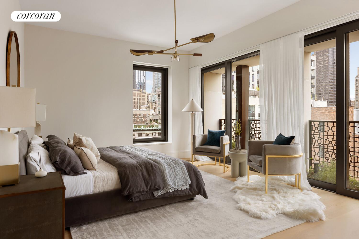 39 West 23rd Street, Unit PH20 Manhattan, NY 10010 - Photo 7 of 15 a spacious bedroom with a bed a couch and large window