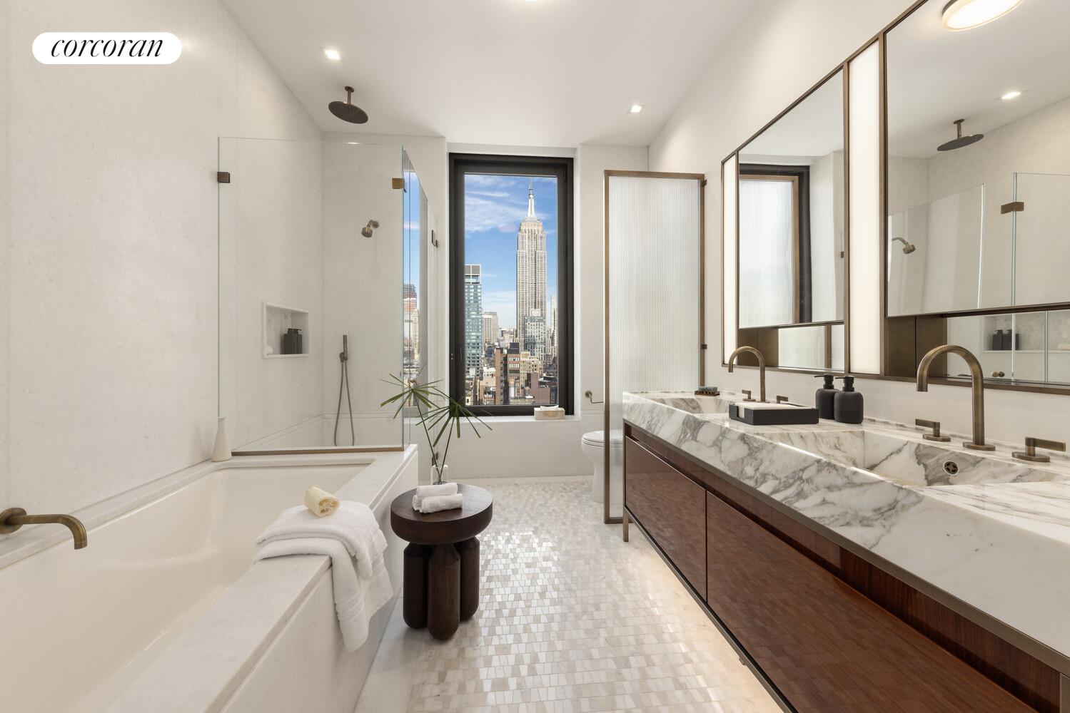 39 West 23rd Street, Unit PH20 Manhattan, NY 10010 - Photo 8 of 15 a large spacious bathroom with a tub sink and mirror