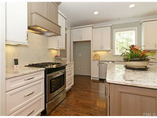 Luxury Kitchen With Built-in Microwave, Stainless Dishwasher, Stainless Gas Range And Designer Light FIxtures. Kitchen