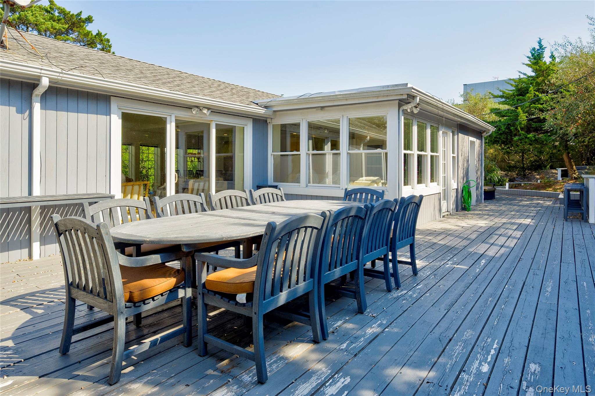 39 Sloop Walk Ocean Beach, NY 11770 - Photo 14 of 50 a view of a dinning table and chairs in patio of the house