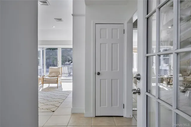 a bathroom with a glass door shower