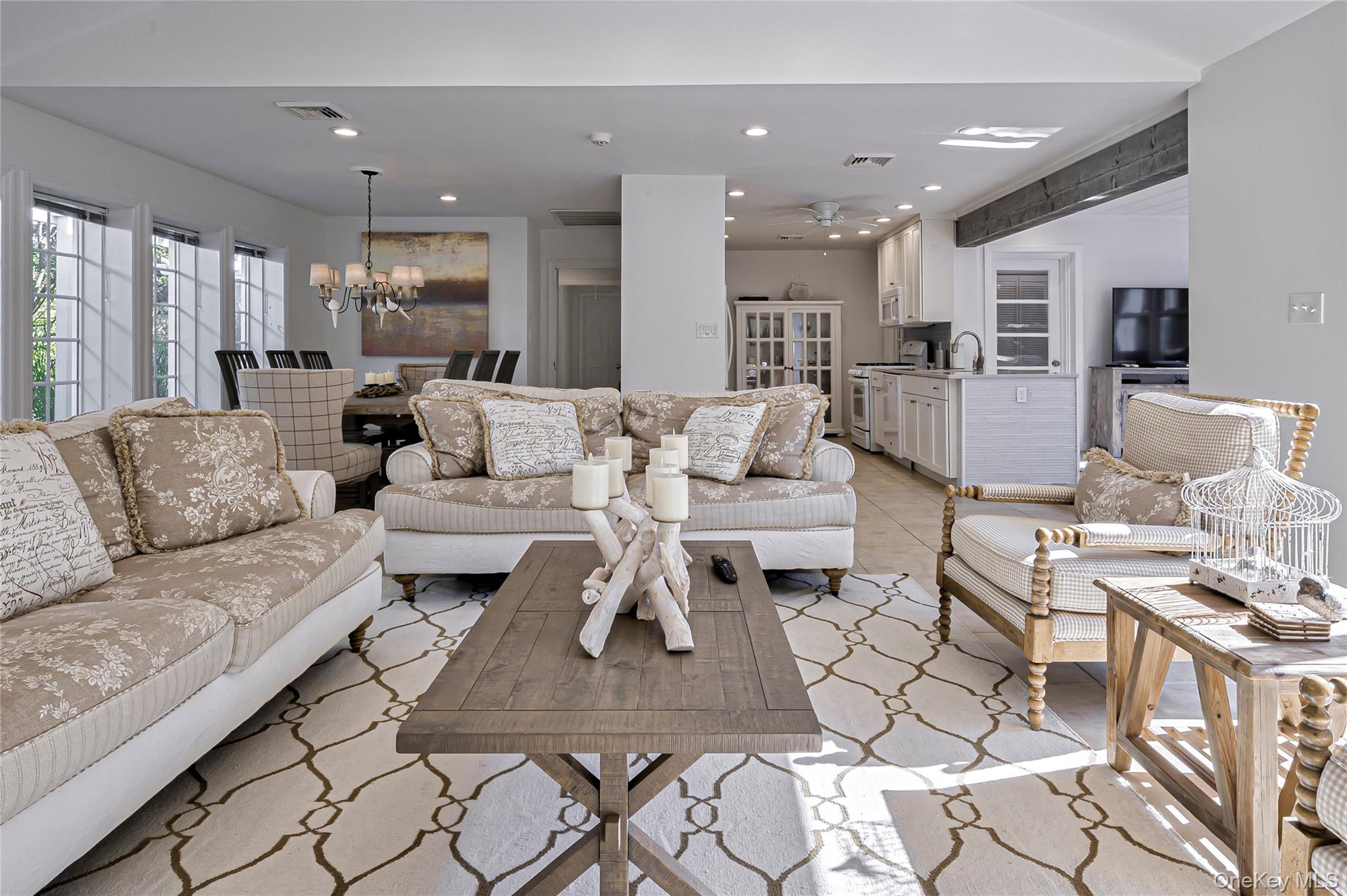39 Sloop Walk Ocean Beach, NY 11770 - Photo 19 of 50 a living room with furniture kitchen view and a table