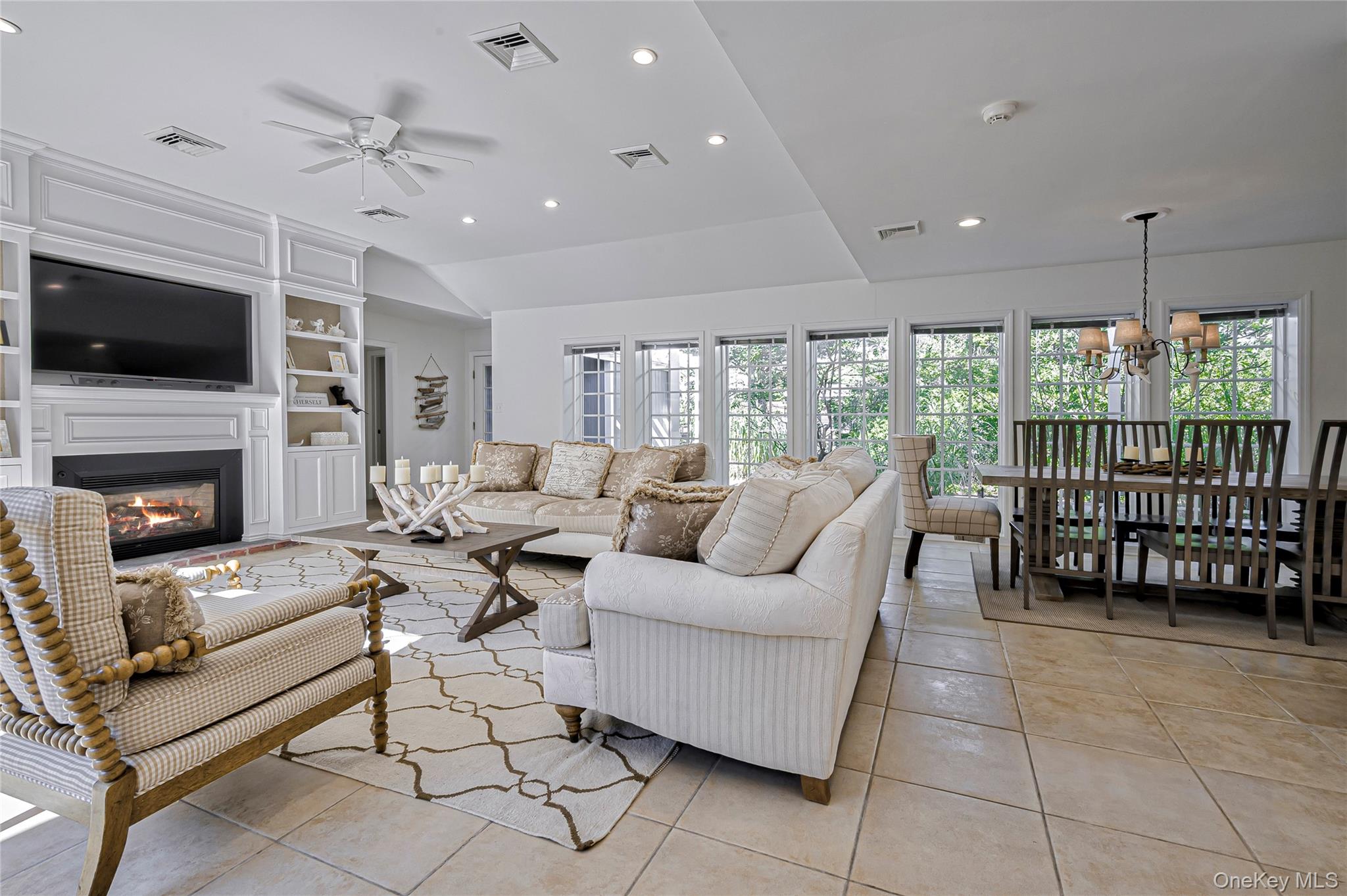 39 Sloop Walk Ocean Beach, NY 11770 - Photo 22 of 50 a living room with furniture a flat screen tv and a fireplace