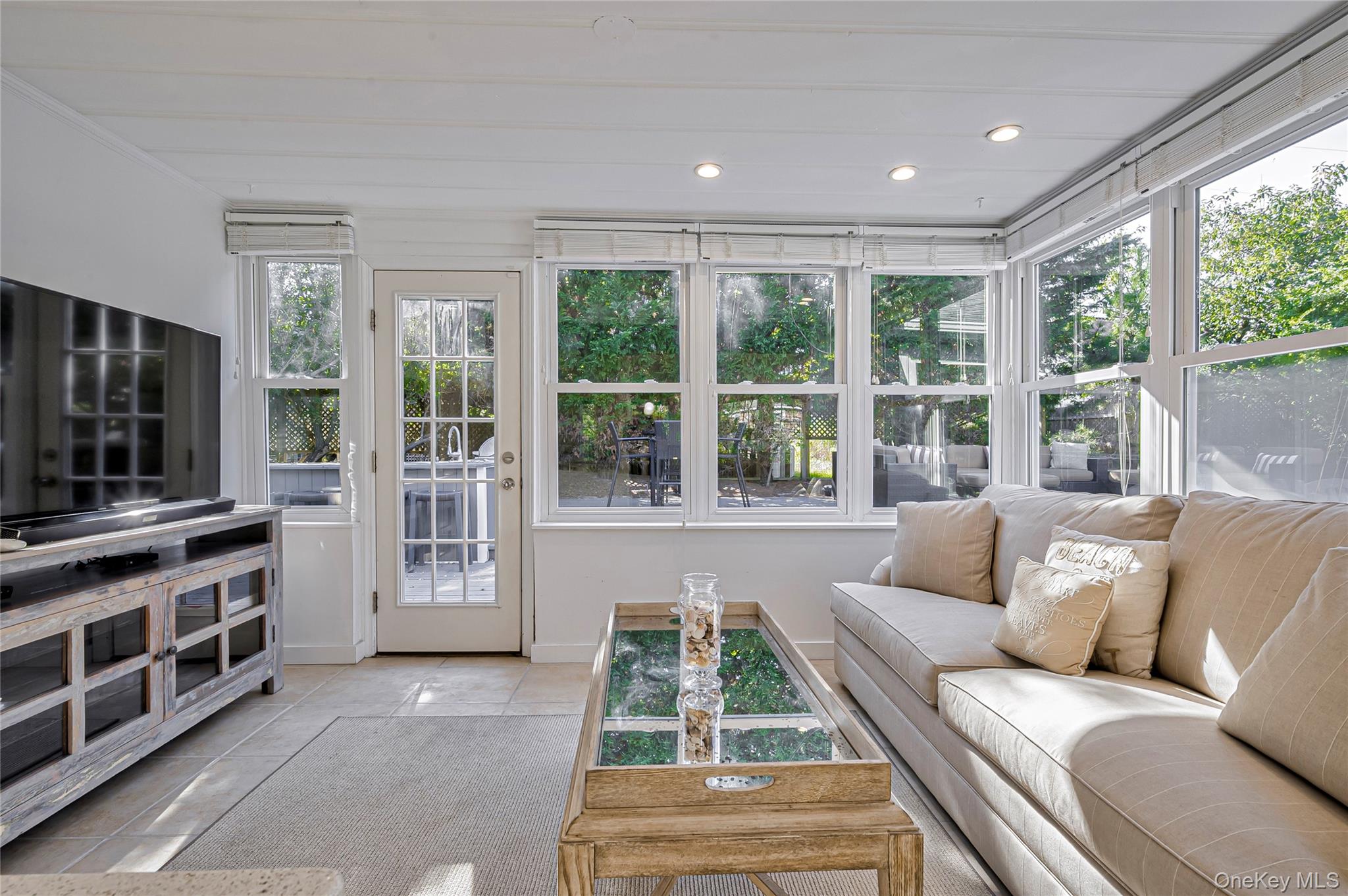 39 Sloop Walk Ocean Beach, NY 11770 - Photo 24 of 50 a living room with furniture and a flat screen tv