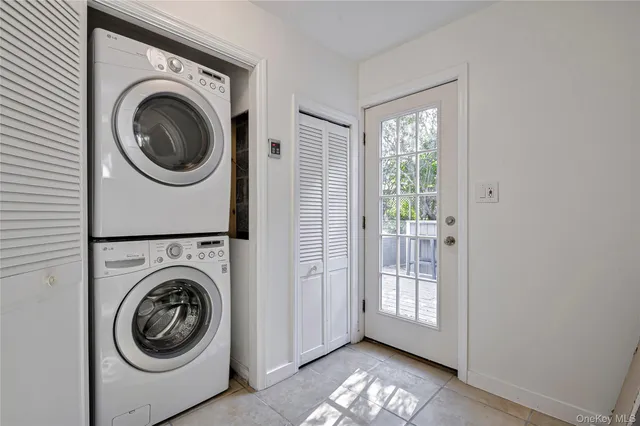 a view of a hallway with washer and dryer