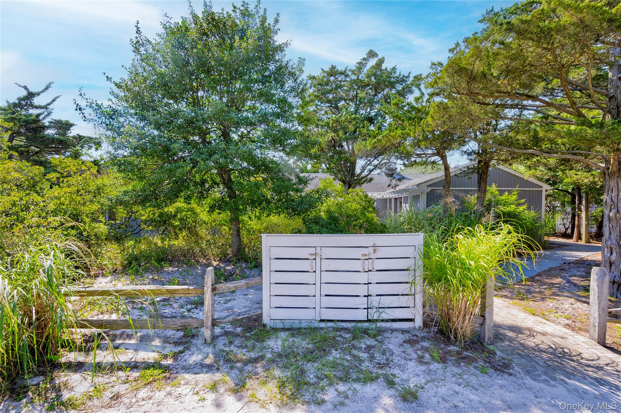 39 Sloop Walk Ocean Beach, NY 11770 - Photo 3 of 50 a view of a backyard with plants