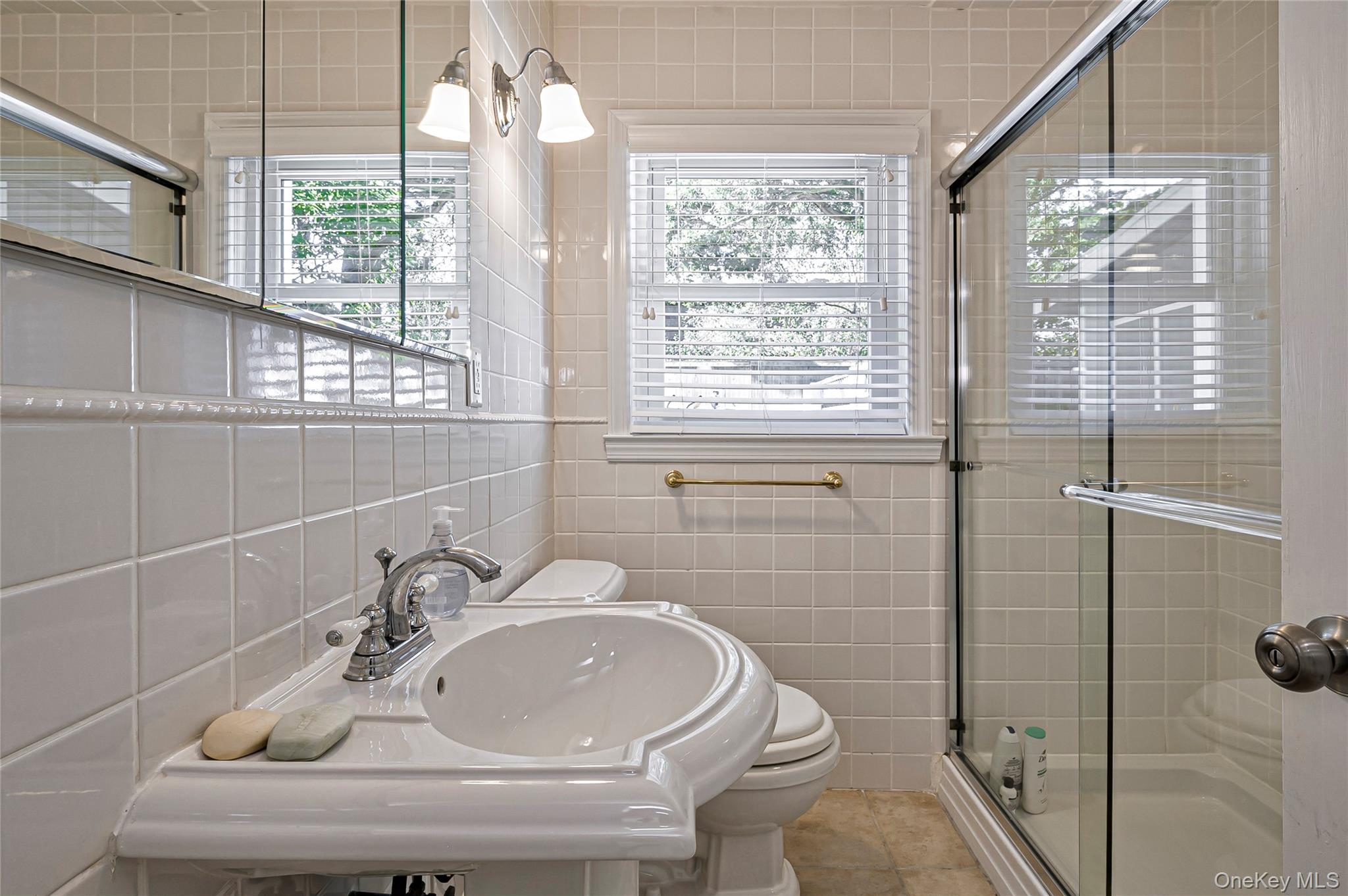 39 Sloop Walk Ocean Beach, NY 11770 - Photo 32 of 50 a bathroom with a sink toilet and shower