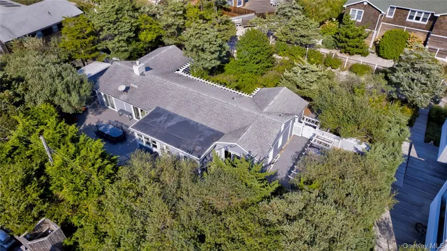 an aerial view of a house with a yard and garden