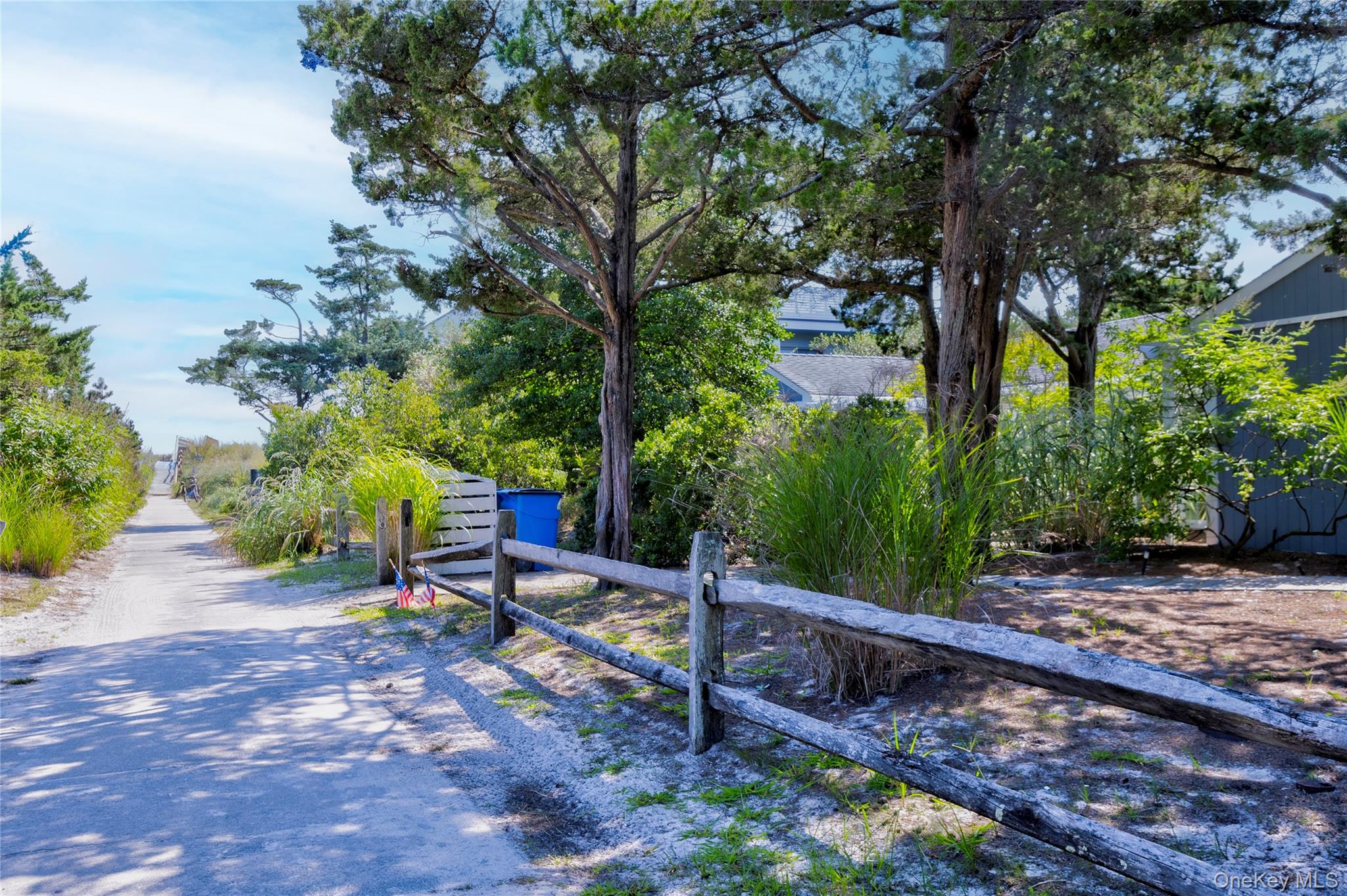 39 Sloop Walk Ocean Beach, NY 11770 - Photo 7 of 50 a view of a bench in a garden