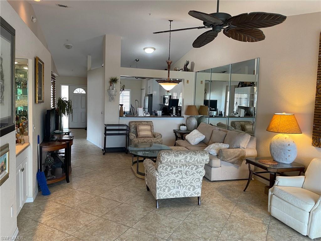 9061 Michael Circle, Unit 2 Naples, FL 34113 - Photo 12 of 48 Living room with tile floors and ceiling fan