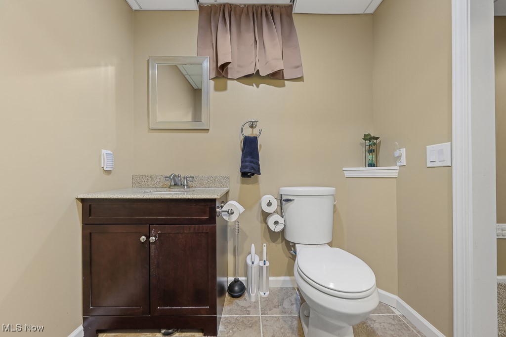 3982 Baird Road Stow, OH 44224 - Photo 35 of 50 Half bathroom featuring vanity and light tile patterned floors