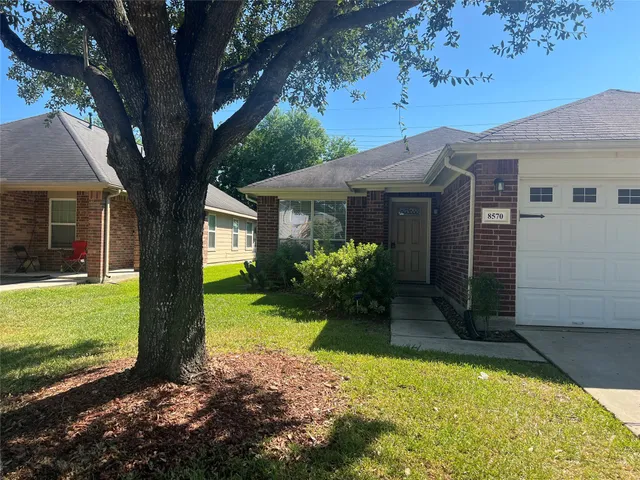 a view of a back yard of the house