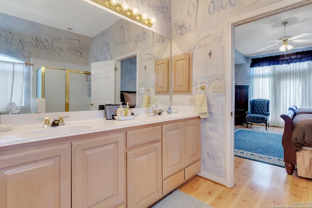 a spacious bathroom with a double vanity sink mirror and