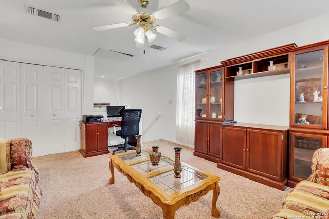 a bathroom with a sink a toilet and shower curtain