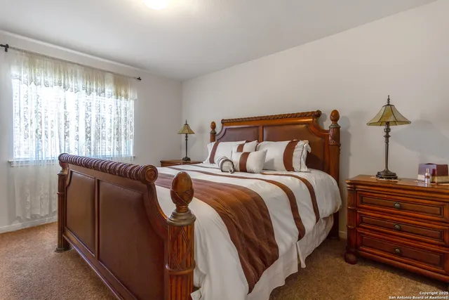 a bed room with a bed and a lamp