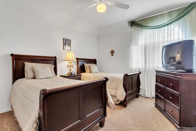 a spacious bathroom with a double vanity sink a mirror and shower