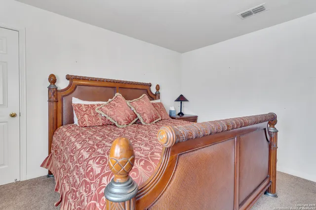 a front view of a house with a garden and yard