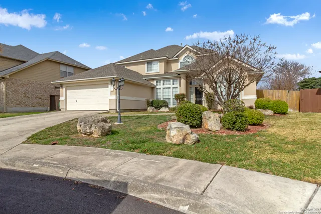a view of a deck with a table and chairs under an umbrella