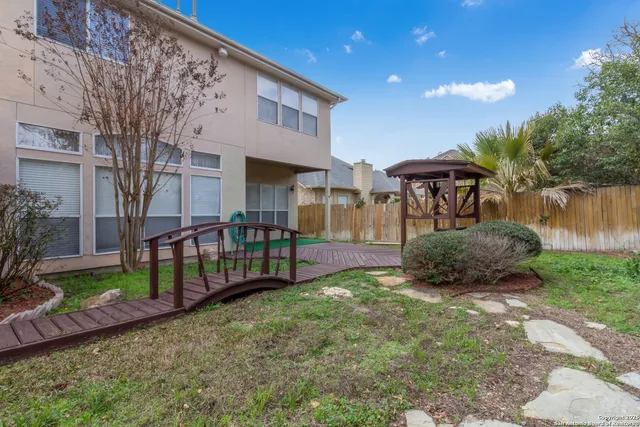 a view of a house with a yard and plants