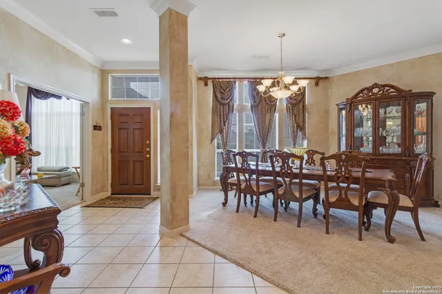 a view of a a dining room with furniture window and outside view