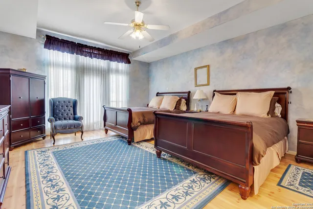 a bedroom with furniture and a rug