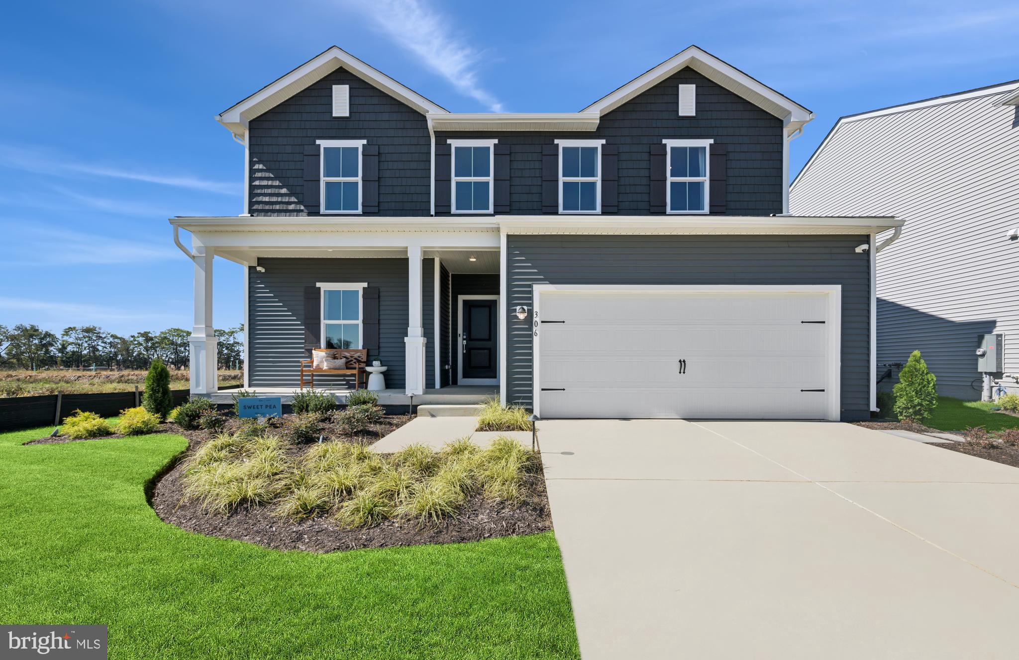 a view of a house with sitting area and garden