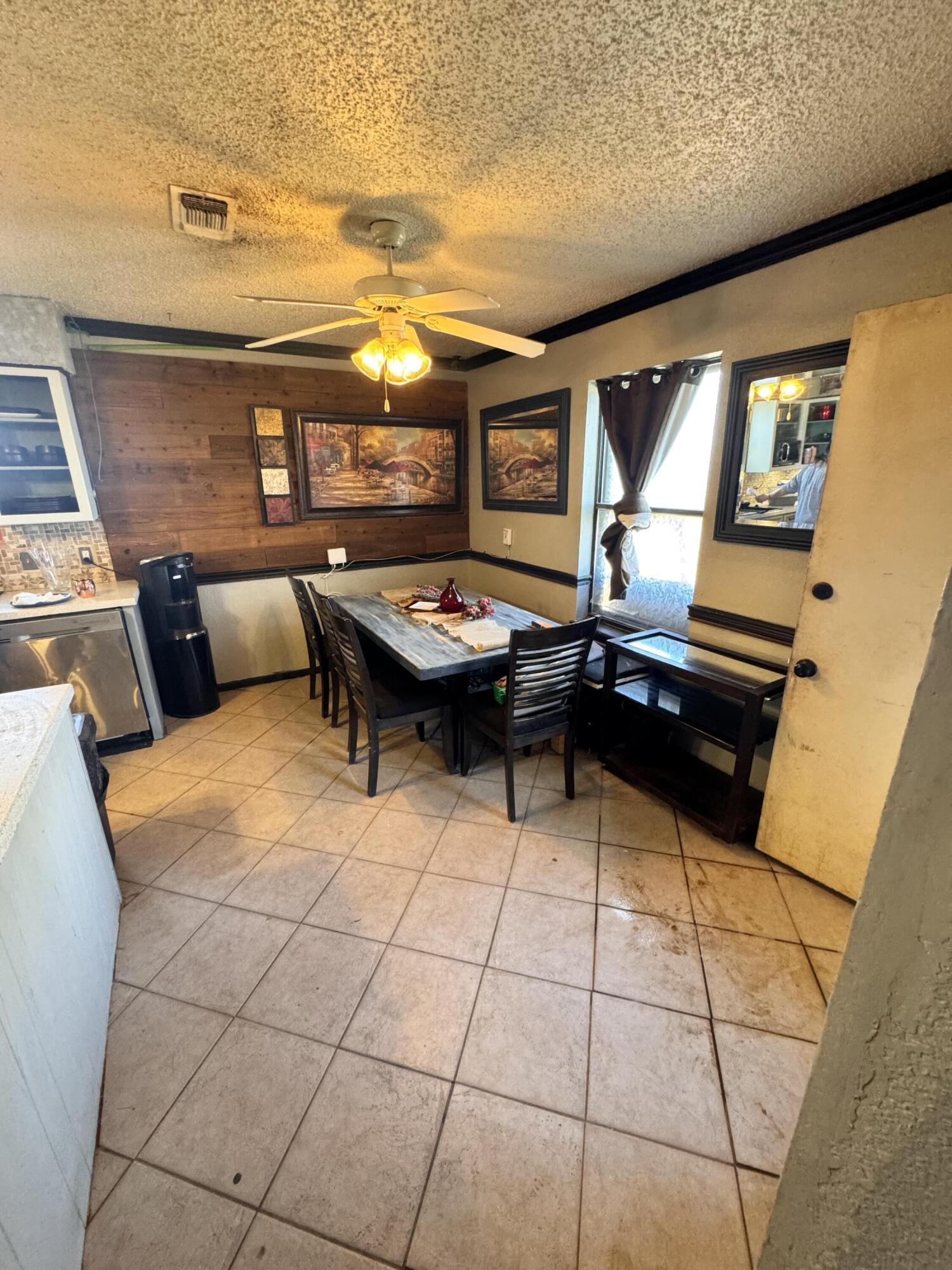302 East 15th Street Wolfforth, TX 79382 - Photo 12 of 13 a living room with furniture and a flat screen tv
