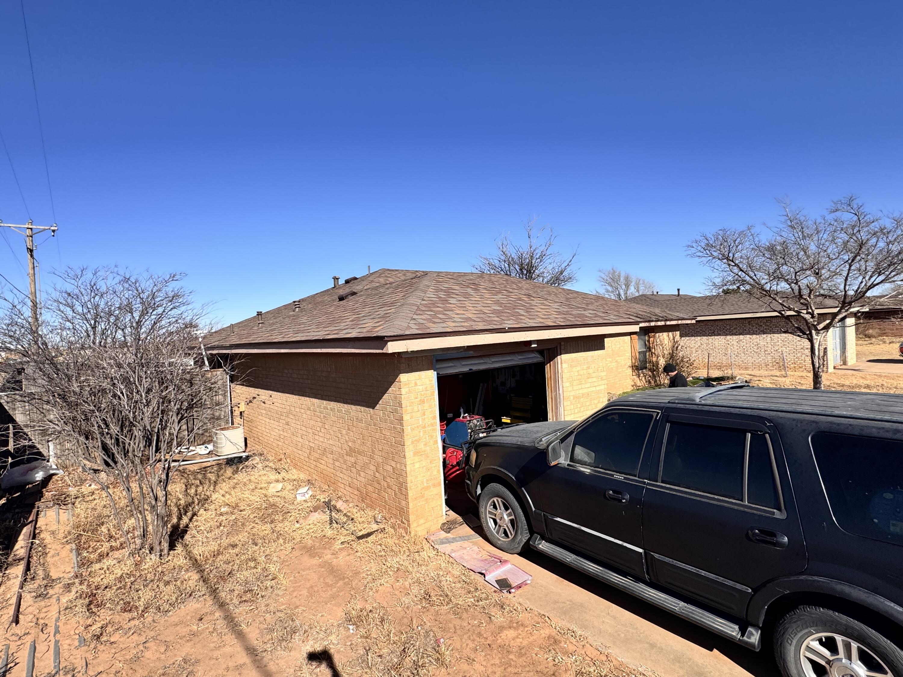 302 East 15th Street Wolfforth, TX 79382 - Photo 3 of 13 a view of a car parked front of a house