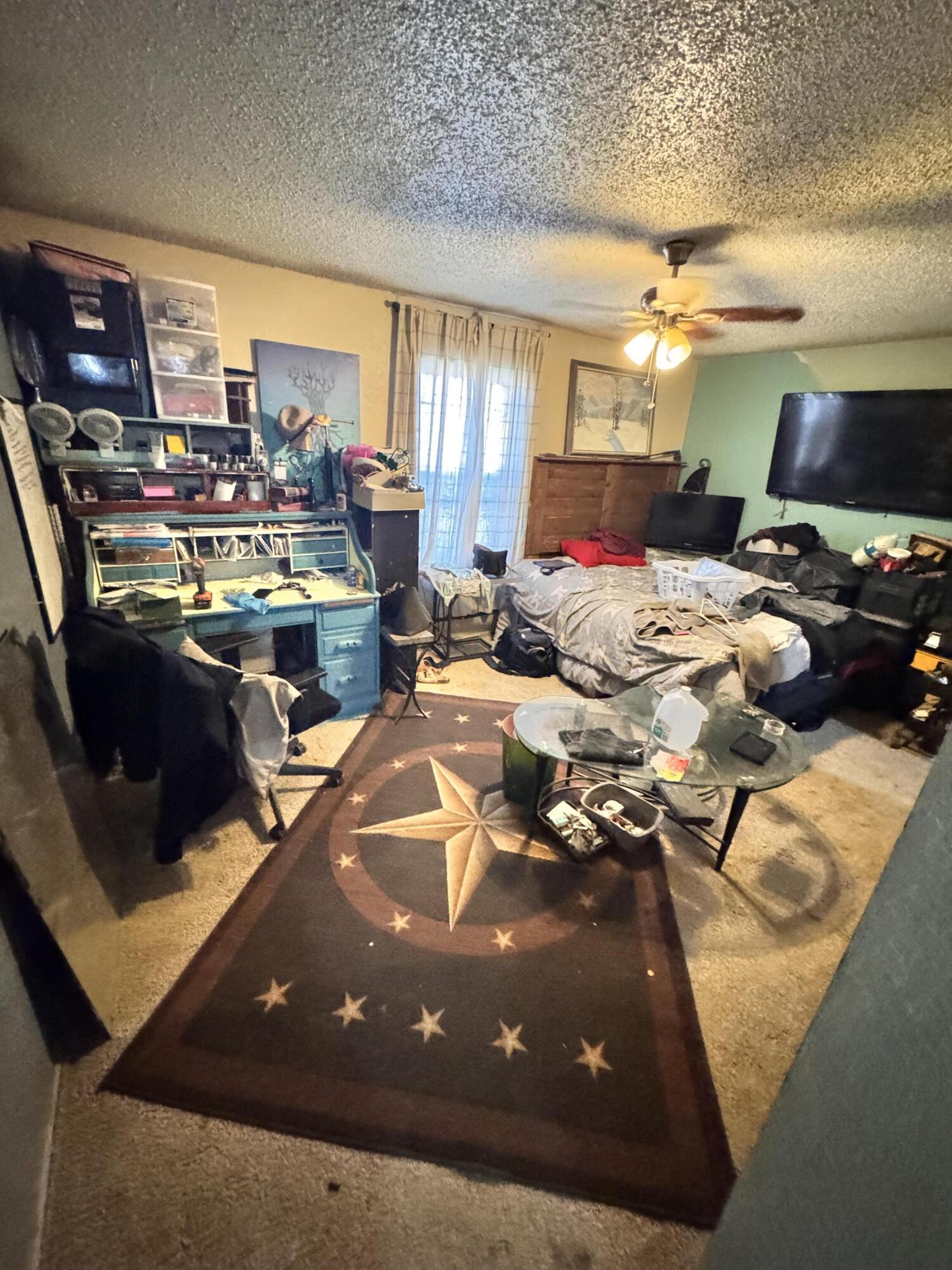 302 East 15th Street Wolfforth, TX 79382 - Photo 7 of 13 a living room with lots of furniture and a view of kitchen