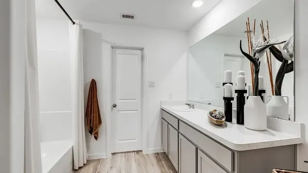 a kitchen with a sink and a refrigerator