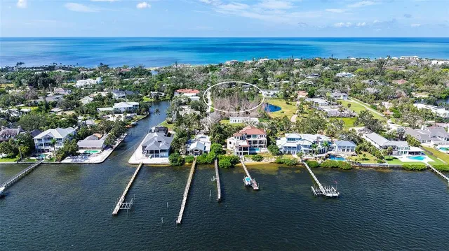 an aerial view of a yard with a table and chair