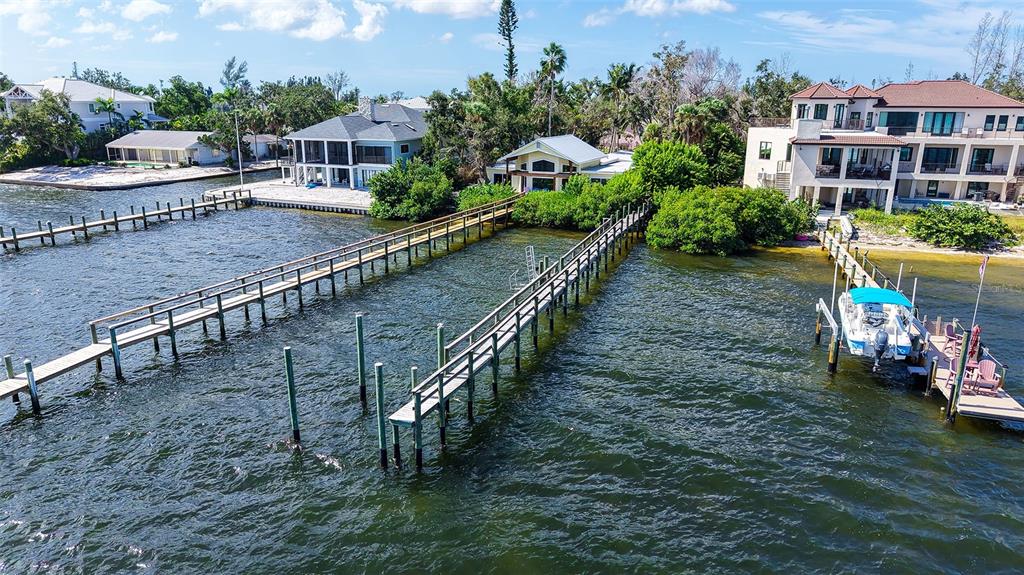 7401 Midnight Pass Road, Unit A Sarasota, FL 34242 - Photo 14 of 22 a view of a chairs and table in the patio