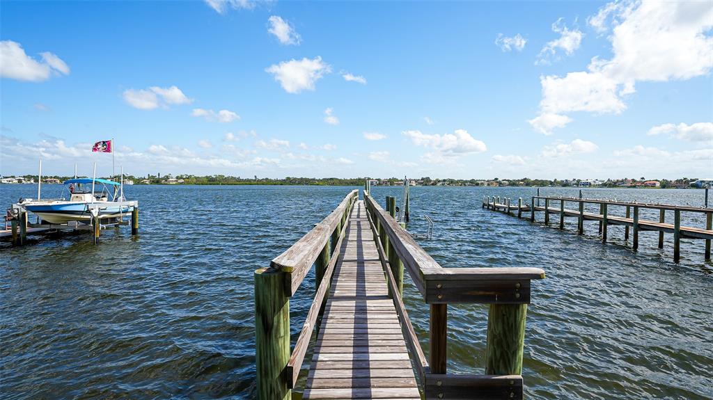 7401 Midnight Pass Road, Unit A Sarasota, FL 34242 - Photo 15 of 22 a view of a terrace with sitting area
