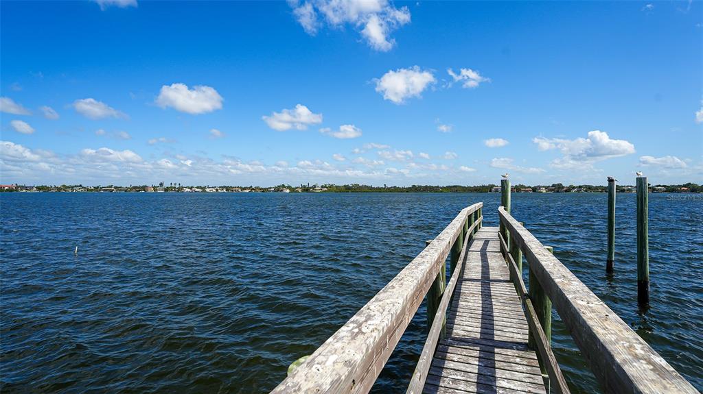 7401 Midnight Pass Road, Unit A Sarasota, FL 34242 - Photo 16 of 22 a view of a balcony with an ocean