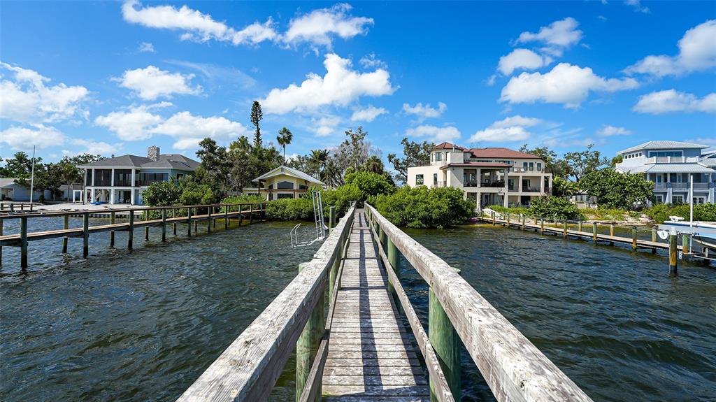 7401 Midnight Pass Road, Unit A Sarasota, FL 34242 - Photo 17 of 22 a view of a lake with a house