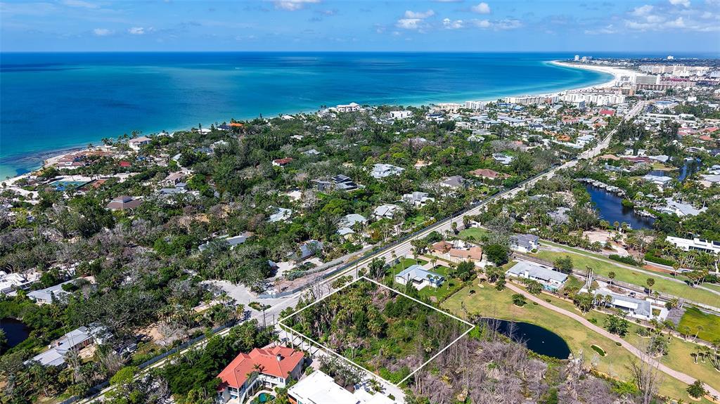 7401 Midnight Pass Road, Unit A Sarasota, FL 34242 - Photo 2 of 22 an aerial view of beach and ocean