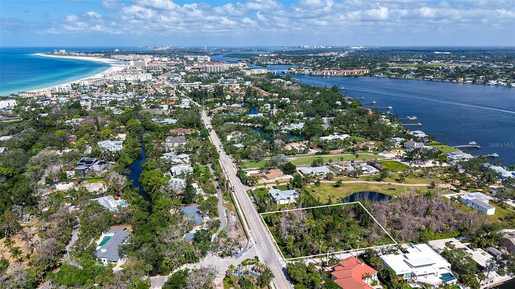 7401 Midnight Pass Road, Unit A Sarasota, FL 34242 - Photo 22 of 22 an aerial view of residential houses with outdoor space