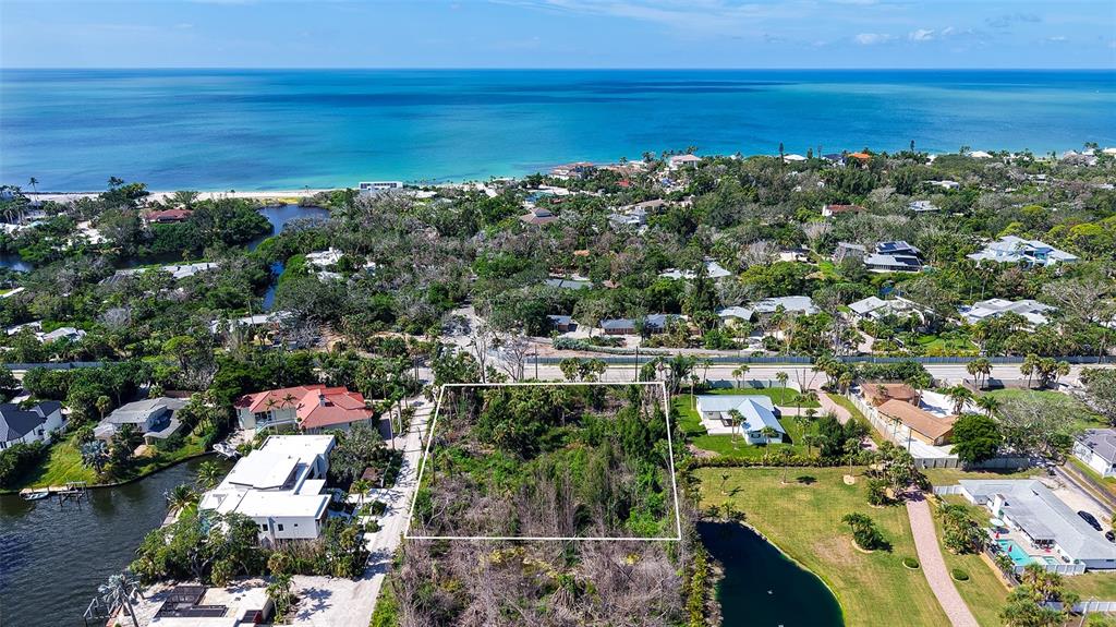 7401 Midnight Pass Road, Unit A Sarasota, FL 34242 - Photo 7 of 22 a view of a city with an ocean