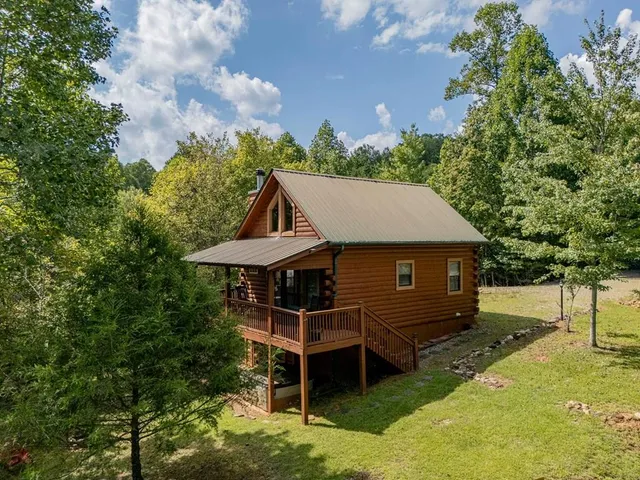 a view of a wooden deck and a yard