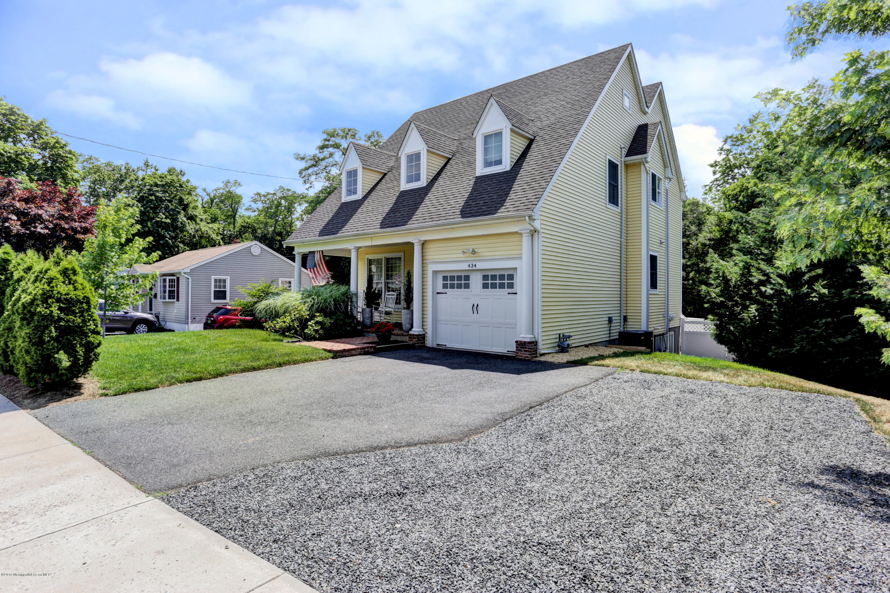 434 E Road Middletown, NJ 07718 - Photo 3 of 30 a front view of a house with a yard and garage