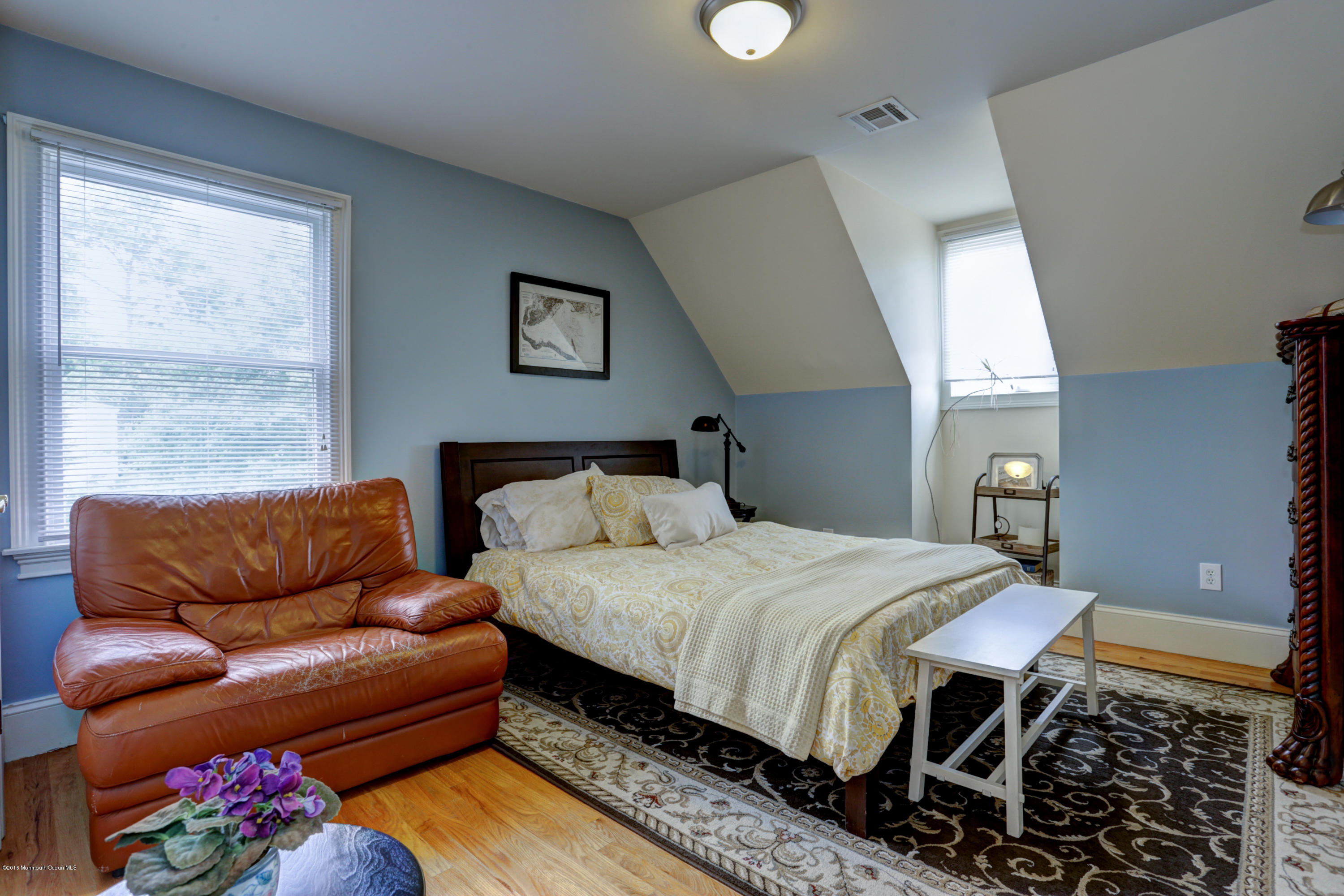 434 E Road Middletown, NJ 07718 - Photo 22 of 30 a bedroom with a bed couch and window