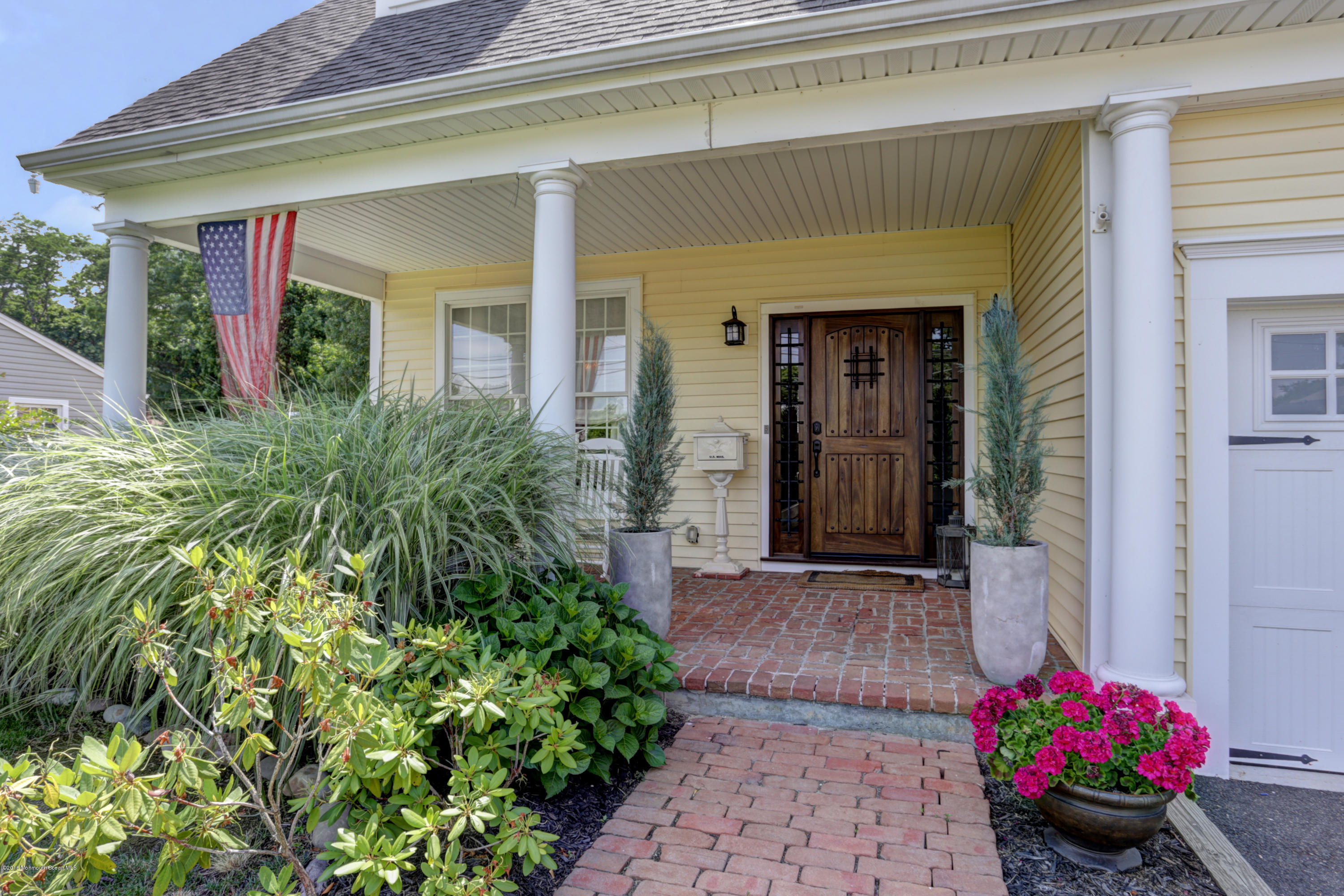 434 E Road Middletown, NJ 07718 - Photo 4 of 30 a front view of a house with a porch