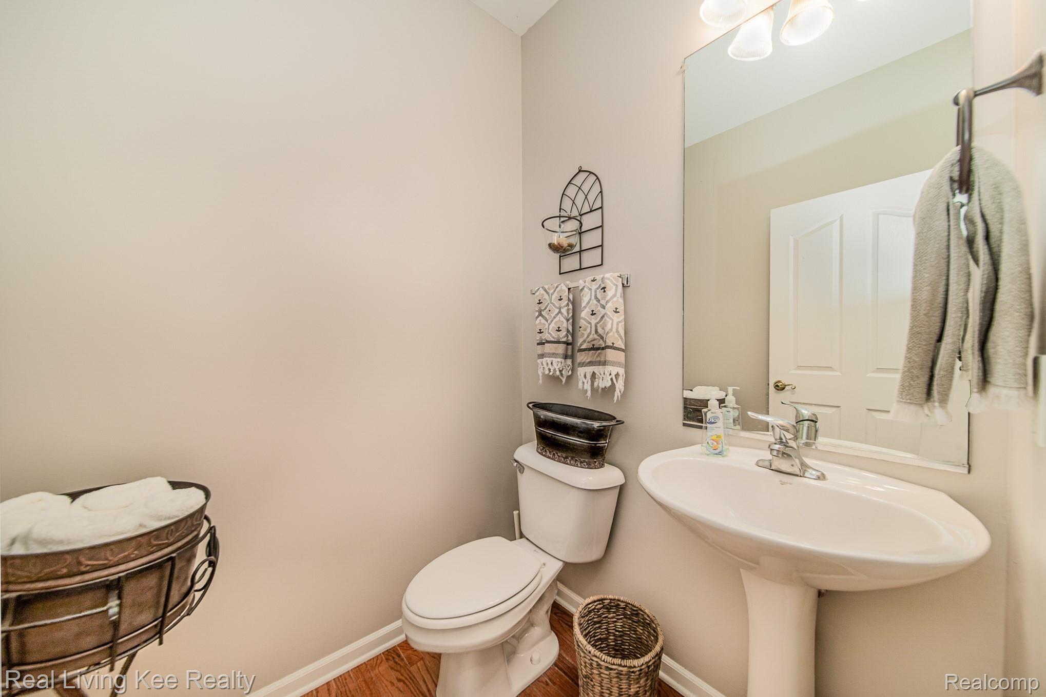 560 Bedlington Drive Rochester, MI 48307 - Photo 20 of 31 Half Bath with Hardwood Floors