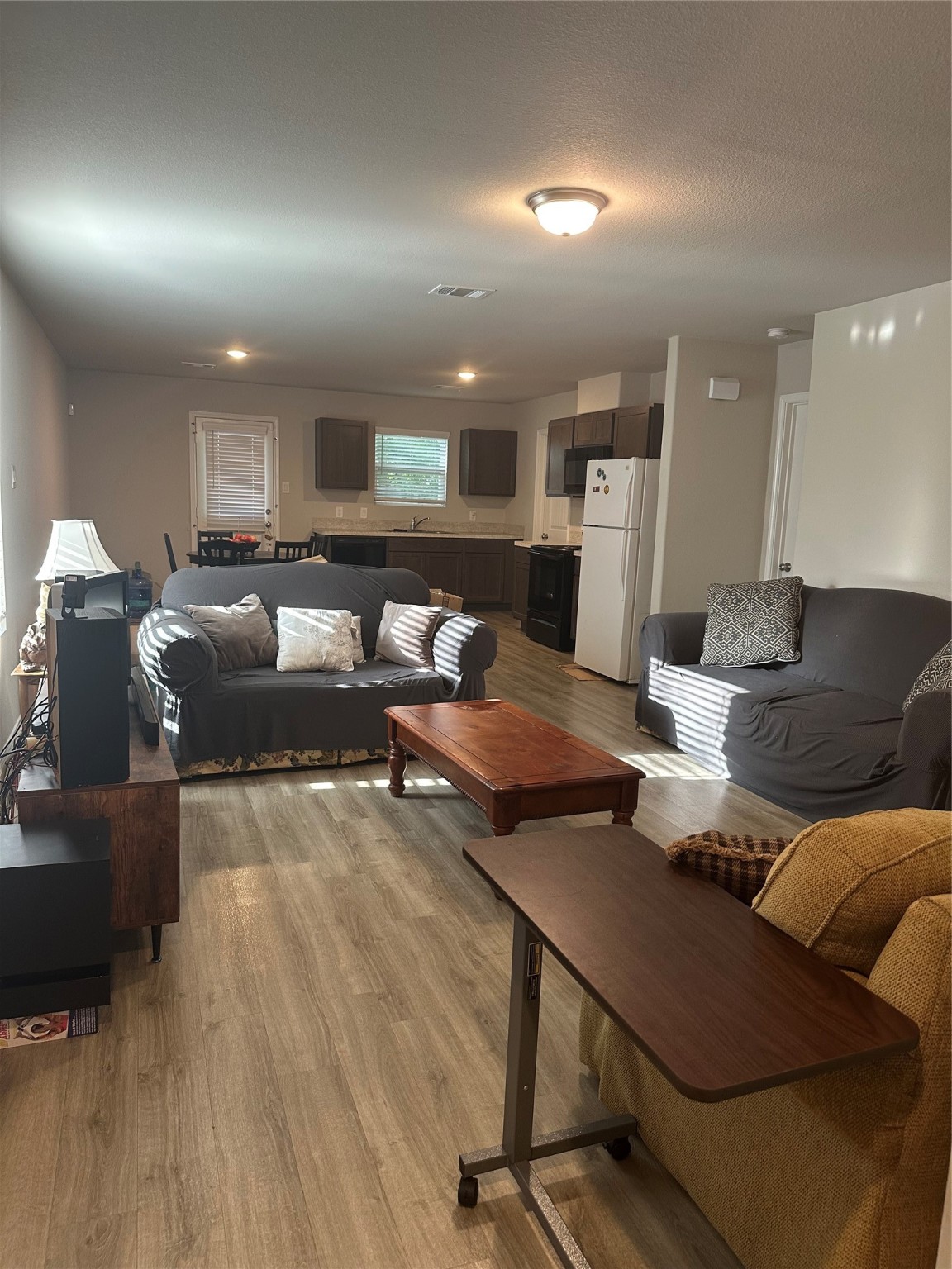 411 Armstrong Street Houston, TX 77029 - Photo 3 of 7 a living room with furniture and wooden floor